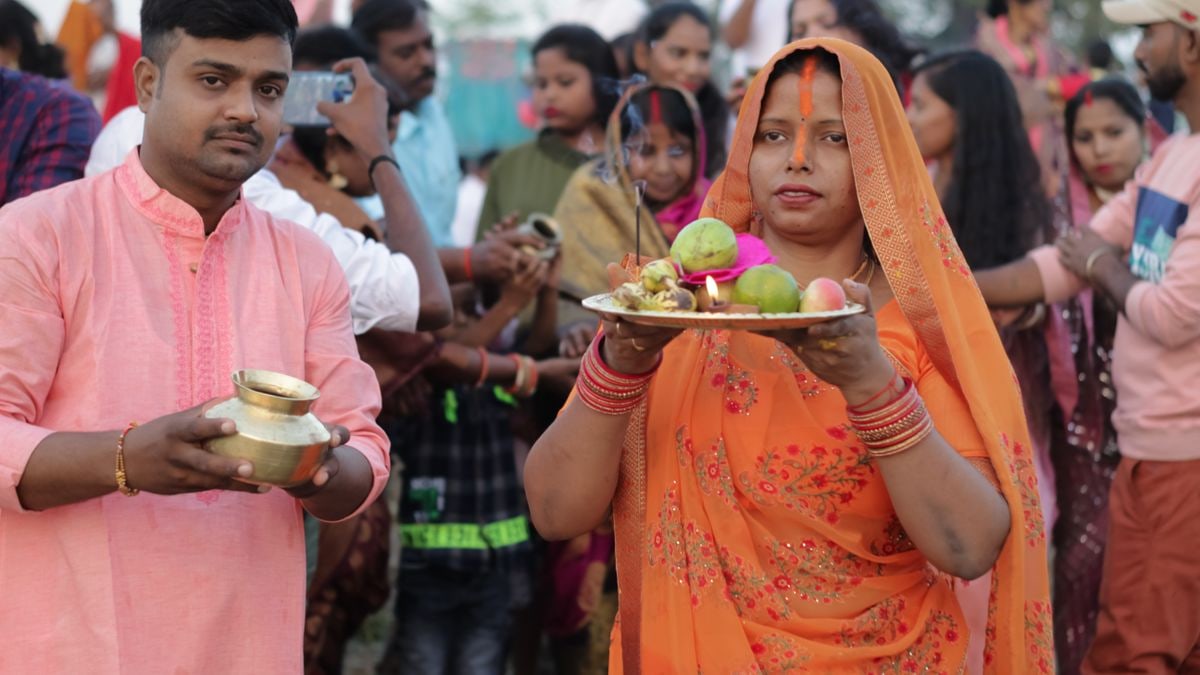 A vibrant depiction of a traditional Indian ceremony with people in colorful attire in Bokaro Steel City, India.